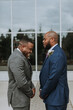 © LEAH FLORES/Stocksy - Groom and Groomsman Laughing before Wedding
