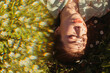 © Liliya Rodnikova/Stocksy - Dreamy portrait of model among flowers and shadows
