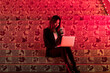 © Makingultimate Xiao/Stocksy - A beautiful Chinese beauty is using a laptop at night