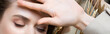 © LIGHTFIELD STUDIOS - cropped view of palm near face of woman with closed eyes, banner