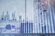 © peshkova - Double exposure of stock market graph drawing and office interior background. Concept of financial analysis.