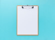 © m________k____ - A clipboard with white paper on a blue background