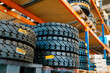 © Ezequiel Gimenez/Westend61 - Tires on rack in auto repair shop