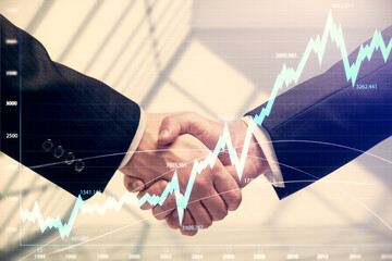 Double exposure of forex graph hologram and handshake of two men. Stock market concept.