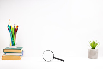 Wall Mural - white study desk background backdrop. books for learning, stationery on a tabletop. offline home workplace. side view