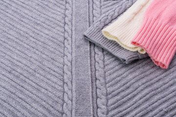 Wall Mural - Textured sweater knitting yarn gray pink white - abstract background image.