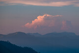 Fototapeta Sawanna - Beautiful sunrise over the mountain range and sea clouds