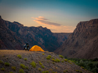 tent and motorcycle in the mountains