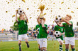 © matimix - Kids celebrating sports success. Victory of children football team in tournament final game. Happy boys in school sports team winning soccer championship. Children smiling and rising up golden cup