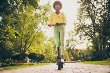 Poster - Full length body size view of her she attractive slender fit slim thin wavy-haired girl wearing leather jacket riding electric scooter enjoying autumn fall fresh air healthy life dream outside outdoor