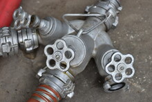 Small Iron Valves On Red Water Pipes Close Up