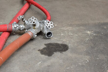 Small Iron Valves On Red Water Pipes