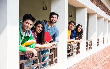 Wall Mural - Education is fun - Cheerful Indian asian young students enjoying togetherness in college campus