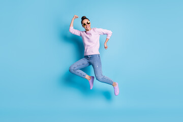 Poster - Full length photo of positive cheerful girl jump enjoy winter season discounts wear good look pullover footwear specs isolated over blue color background