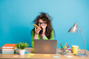 Poster - Photo of busy brown messy hair girl sit table use smart call speaker phone whisper isolated blue color background