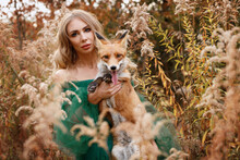 Girl With Red Fox In Autumn