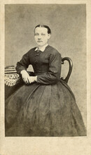 Civil War Era 1860s Woman Sitting Next To Table In Hoop Skirt