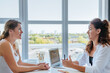 © lithiumphoto - Happy female coach is consulting young woman