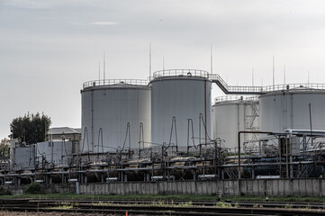 Tanks oil storage against the solf sky. Storage tanks for petroleum products. Equipment refinery.