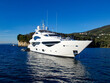 © William Richardson - white super yacht power boat anchored at sea