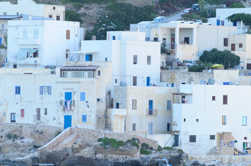 Island of Levanzo, Sicily, Italy, july 2020. This little sea town in the Egadi islanIsland of Levanzo, Sicily, Italy, july 2020. This little sea tos is wonderful with its white houses and blue windows