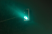 Green Traffic Light In Foggy Night