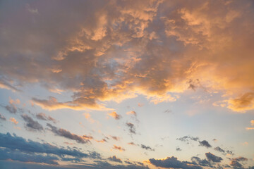 orange pink evening sky just after sunset - afternoon clouds background