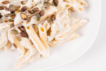 Sticker - Pasta with blue cheese and cream sauce, sprinkled with roasted pumpkin seeds