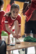 © luckybusiness - A little girl posing for a photo while preparing for a training. Children team sport