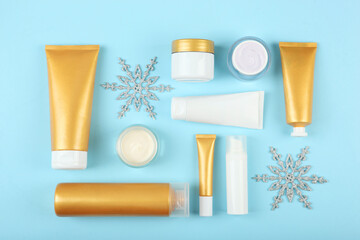 Wall Mural - Winter care cosmetics on a colored background top view. set of cosmetics for winter care
