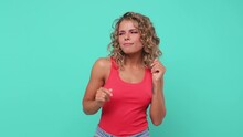 Smiling Cheerful Beautiful Young Blonde Woman 20s Years Old In Pink Tank Top Posing Isolated On Blue Turquoise Background Studio. People Sincere Emotions Lifestyle Concept. Dancing Snapping Fingers