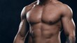 © Acronym - Fit and sporty bodybuilder over black background. Sportsman in studio. Sport and fitness concepts.