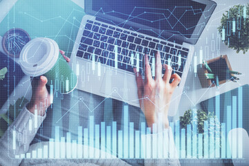 Double exposure of woman hands working on computer and forex chart hologram drawing. Top View. Financial analysis concept.