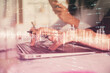 © peshkova - Multi exposure of woman hands typing on computer and financial graph hologram drawing. Stock market analysis concept.