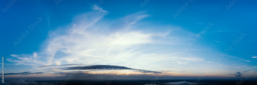 Dawn or sunset over the clouds, blue hour, aerial view. - obrazy, fototapety, plakaty 