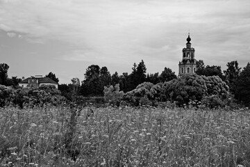 Orthodox church on the shore of the lake in the village of Ubory, Moscow region, Russia.