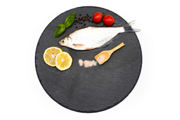 Wall Mural - Fish with aromatic herbs, spices and vegetables - healthy food, diet or cooking concept