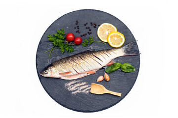 Wall Mural - Fish with aromatic herbs, spices and vegetables - healthy food, diet or cooking concept