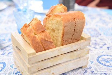 Wall Mural - Fresh Bread in a Wooden Box