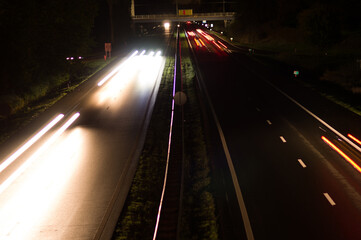 Wall Mural - Highway at night with traffic blurred by motion in arnhem, Netherlands