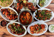 © Mahi - Assorted indian foods chicken pahadi kebab,chicken angara kebab,tandoori chicken,pepper chicken, paneer tikka and chicken masala on wooden background. Dishes and appetizers of indian cuisine