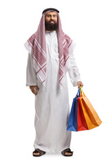 Full length portrait of an arab man in a thobe holding shopping bags