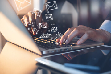 business man sending email via laptop computer