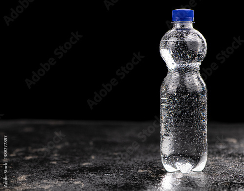 Chilled bottled sparkling water (close-up shot)