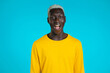 © kohanova1991 - African man depicts amazement, shows WOW delight face effect. Surprised excited happy guy. Handsome male shocked model on blue background.