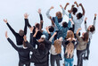 © ASDF - group of diverse young people pointing somewhere up