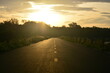 © chatgunner - the road line to foward destination with sunlight