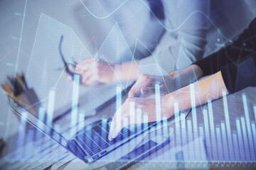 Multi exposure of woman hands typing on computer and financial chart hologram drawing. Stock market analysis concept.