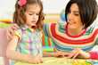 © aletia2011 - Cute little girl with her mother studying