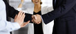 © cameravit - Unknown businesspeople are shaking their hands after signing a contract at meeting, close-up. Business communication concept